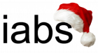 Das IABS-Berlin Unternhemens-Logo mit einer Weihnachtsmütze, symbolisiert die weihnachtliche Stimmung bei der Unternehmensberatung in Berlin.